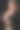 快乐的母亲抱着一个熟睡的新生男婴，黑色的背景。妈妈微笑着，手里抱着一个孩子图片下载