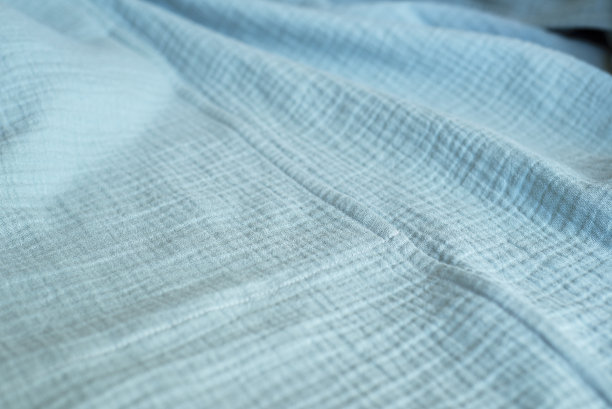 青绿色棉布织物。天然有机棉织品。图片下载