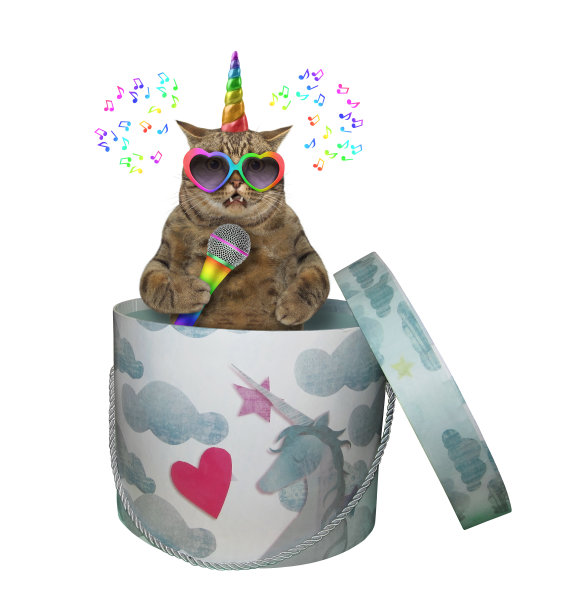 猫独角兽在圆形礼品盒里唱歌图片下载