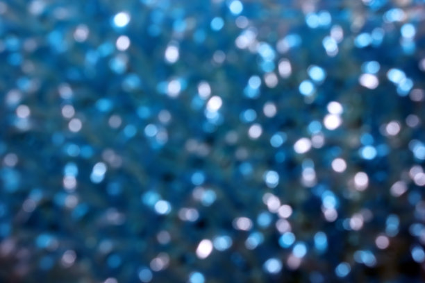 蓝色毛巾特写。从顶上看。纹理。背景。抽象。针织毛巾。自我保健。该毛巾由丙烯线制成。模糊的照片图片下载