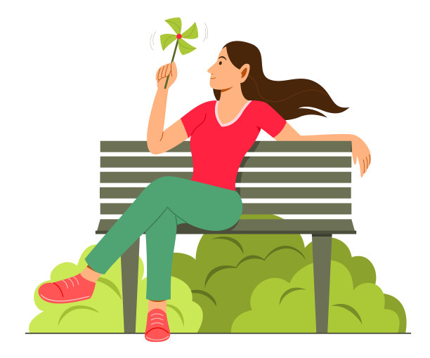 女人在花园里玩纸风车图片下载