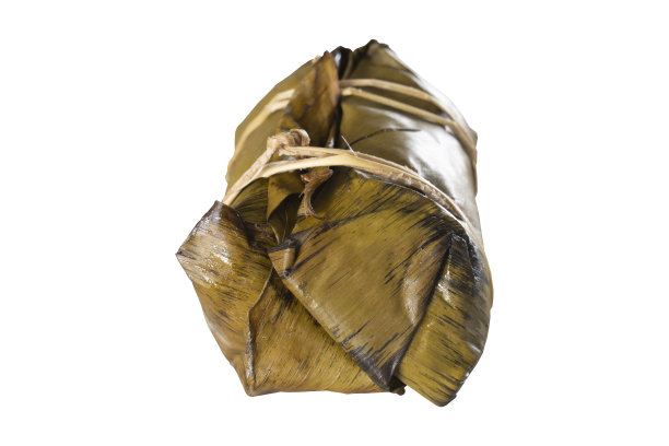 旁边的观点香蕉糯米饭美味小吃来自泰国。用香蕉叶盖着，椰子叶梗着。图片下载