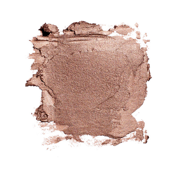 在白色背景上涂抹金色哑光金属唇膏或奶油眼影纹理的豪华化妆品概念图片下载