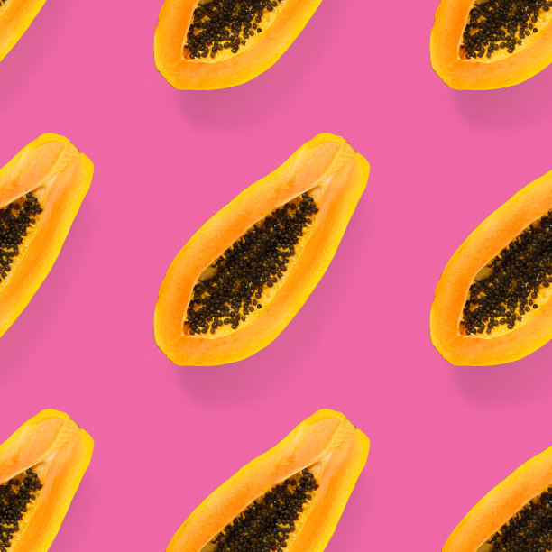 新鲜成熟的木瓜无缝的图案在粉红色的背景。热带抽象背景。前视图。图片下载