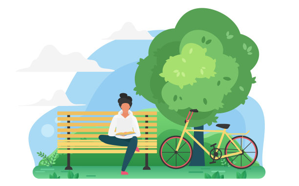 一个年轻人在自行车附近的公园里看书图片下载