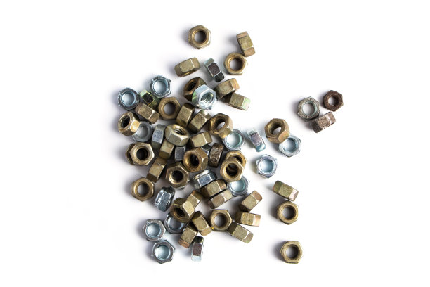 新的金属螺母隔离在白色背景。施工和维修工具。图片下载