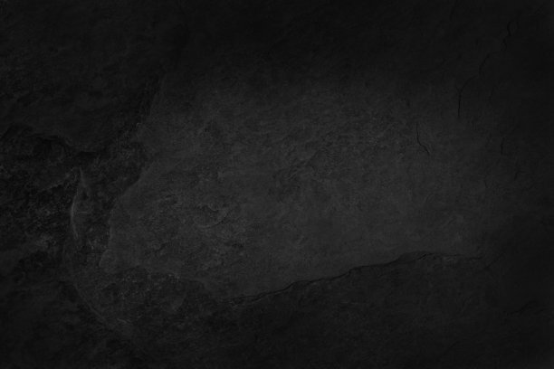 深灰黑色板岩纹理自然图案，具有高分辨率的背景和设计艺术作品。黑色的石墙。图片下载