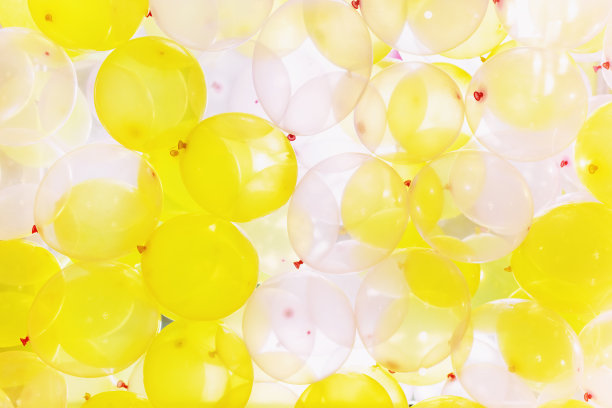 背景由黄色和白色的气球组成图片下载