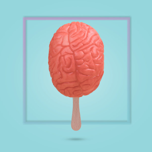 用一根冰淇淋棒和蓝色背景上的人脑做的创意有趣的想法。图片下载