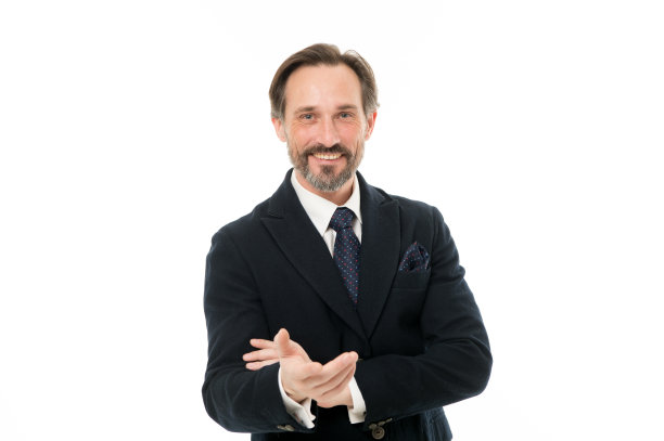 男人英俊成熟的时尚模特穿着白色背景的时尚西装。定制西装使每个穿着者都很讨人喜欢。西装给人以自信的感觉。适合任何类型的男人图片下载