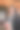 一个美丽的黑发披肩女郎在街上的特写照片，她手里拿着一个红色的纸杯图片下载