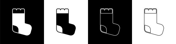 设置婴儿袜子衣服图标孤立在黑白背景。向量图片下载