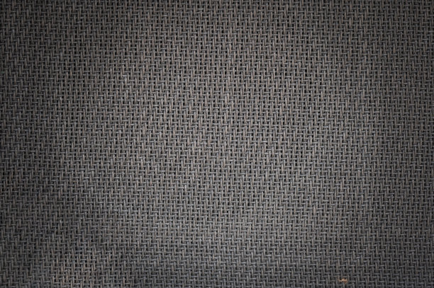 棕色和黑色的扬声器格栅布从古董电吉他放大器柜。背景或纹理。图片下载