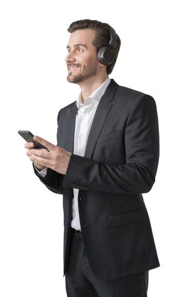 年轻的欧洲人穿着优雅的西装，戴着耳机和智能手机听着音乐，与世隔绝图片下载