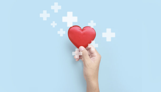 手牵红心。心脏健康捐赠概念图片下载
