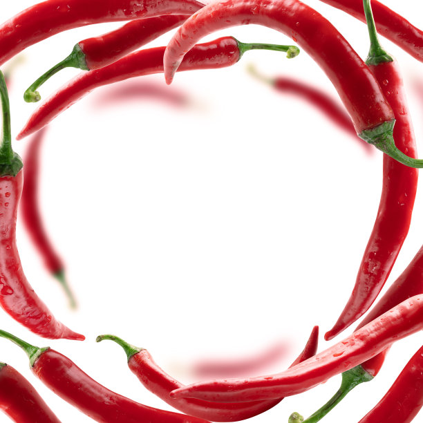 红色的辣椒漂浮在白色的背景上图片下载