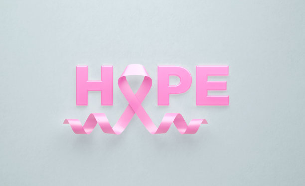 粉红乳腺癌意识丝带和灰色背景的希望之词图片下载