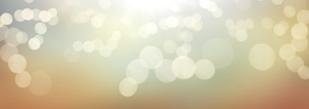 一个秋天阳光明媚的天空与金橙棕色模糊的叶散景背景图片下载