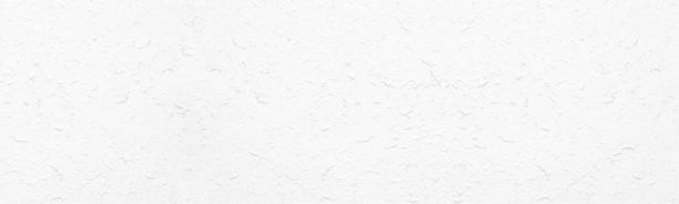 白色粗糙的纹理表面。粉刷墙壁。光宽大纹理。抽象的全景背景图片下载