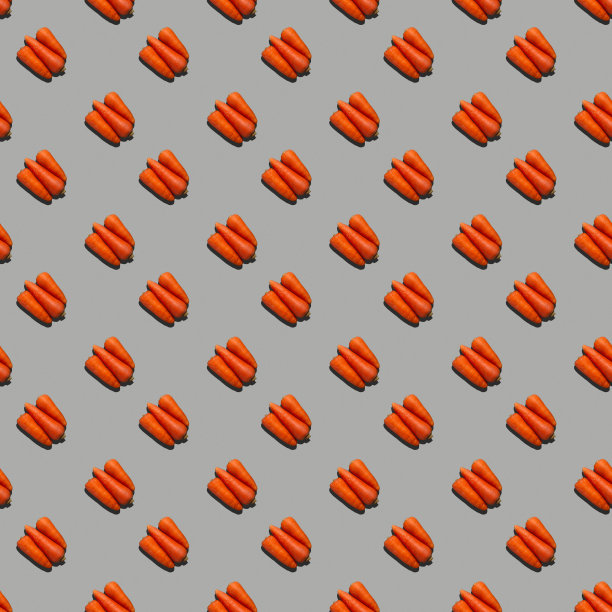 无缝模式从新鲜多汁的胡萝卜上统一的颜色背景。图片下载