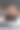 特写图片:白色盘子里装着未包装的纸杯蛋糕，没有咬痕和金属叉子，巧克力黄油糖霜在巧克力块上旋转，黑色背景，聚焦前景图片下载