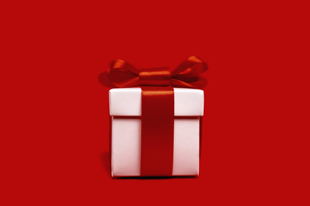 红色背景上的红色和白色礼盒图片下载