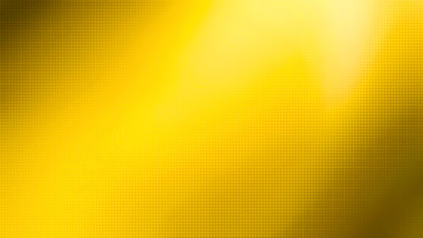 模糊的黄色渐变背景与半色调(点)梯度叠加使用作为创意概念。波普艺术黄色半色调，漫画背景。亮黄色背景上的黑点。图片下载