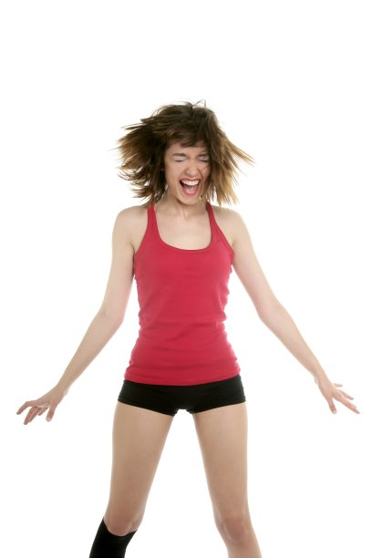 美丽性感的女人在演播室的红色舞蹈图片下载