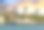 米科诺斯岛的风车排成一排，壮观的落日照亮了背景。图片下载