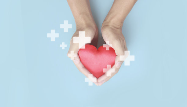手牵红心。心脏健康捐赠概念图片下载