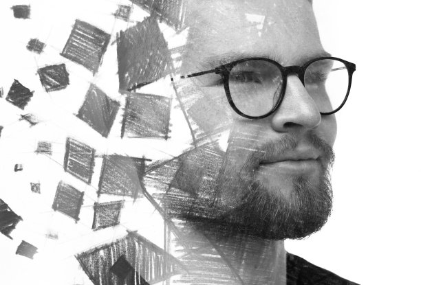 用双重曝光技术结合抽象几何图形的黑白男子肖像。图片下载