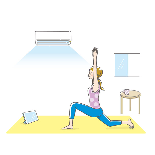 一名年轻女子一边做瑜伽一边看着平板电脑图片下载