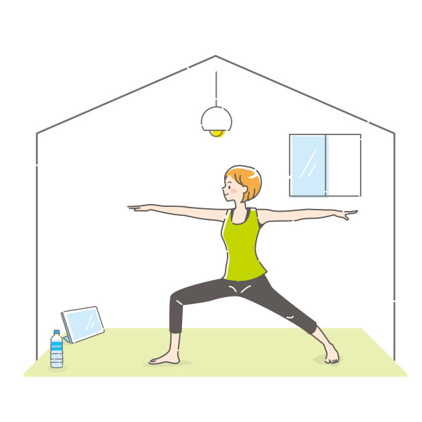 一名年轻女子一边做瑜伽一边看着平板电脑图片下载