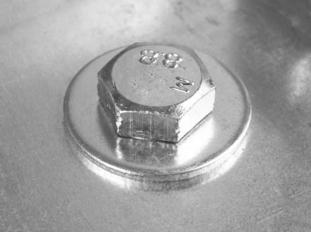 宏观抛丸金属螺栓施工背景。镀铬螺栓纹理。钢螺栓工作工具。图片下载