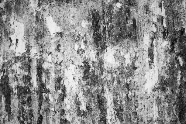 旧墙的背景上有黑色的污迹。图片下载