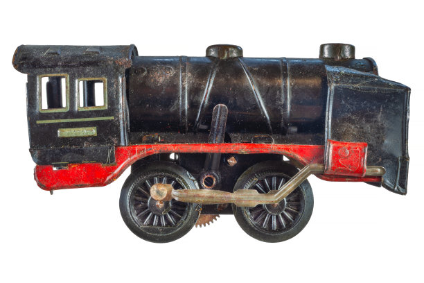 锈迹斑斑、饱经风霜的黑色玩具火车机车被隔离在白色上图片下载