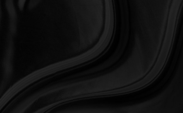 黑灰色缎子深色面料纹理豪华闪亮，是抽象的丝织品背景与图案软波模糊美丽。图片下载
