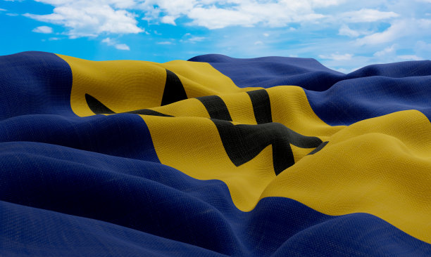 风中飘扬的巴巴多斯国旗，逼真的波浪形织物国旗，3D渲染图片下载