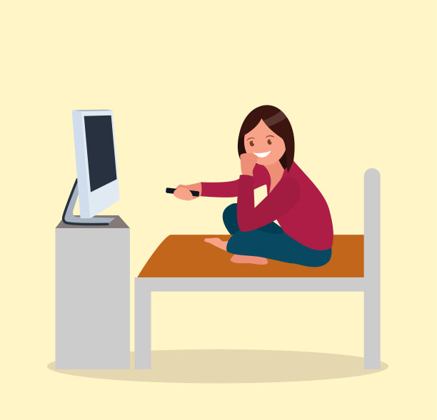 一个女人正坐在沙发上看电视。图片下载