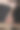 深色背景下，一名男子拿着一块生的战斧牛排和一根干的陈年牛肉骨头图片下载