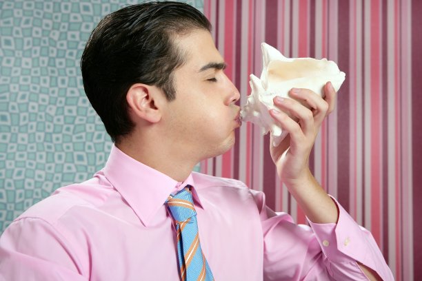 商人用海贝壳，度假的比喻图片下载