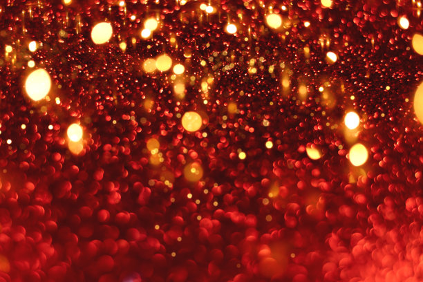 红色和金色闪光的散景背景图片下载