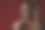 特写的年轻和美丽的女人享受棒棒糖，好看可爱迷人，欢快的马尾辫，微笑，在一个红色的背景。股票摄影。图片下载