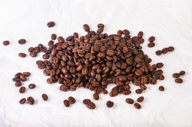 为咖啡馆菜单或小册子模板的自然背景-棕色烤咖啡豆的宏观照片，接近图片下载