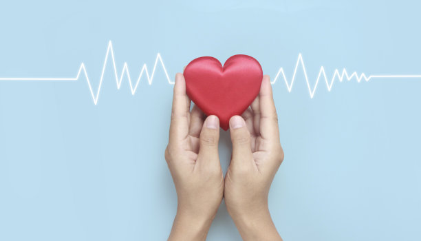 手牵红心。心脏健康捐赠概念图片下载