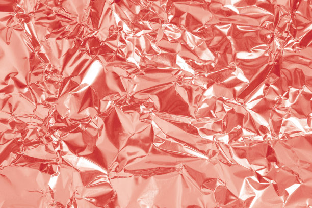 玫瑰金箔纹理背景，粉色包装纸图案皱巴巴、波浪形。图片下载