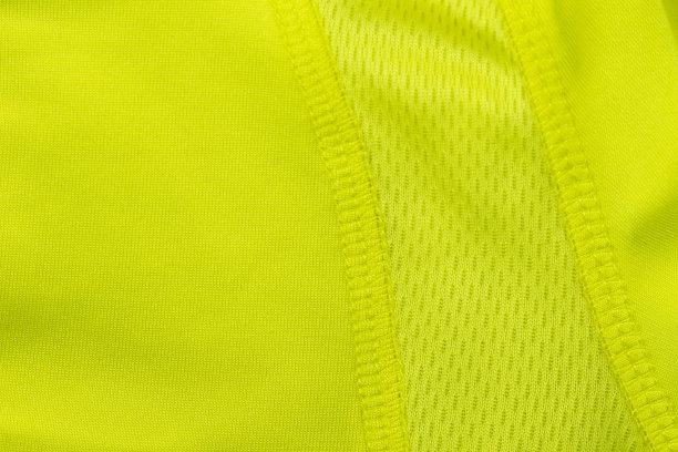 一种绿色的有网眼的运动用合成纤维。图片下载