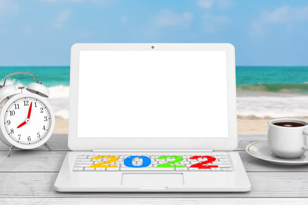 Modern Laptop with New 2022 Year Sign, Cup of Coffee and Alarm Clock in front of Ocean. 3d渲染图片下载