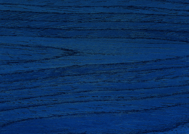 拉近奢华的蓝色胡桃木纹理背景，呈现出美丽的木纹。封闭饰面木材料完成工作。蓝色的木质纹理。图片下载