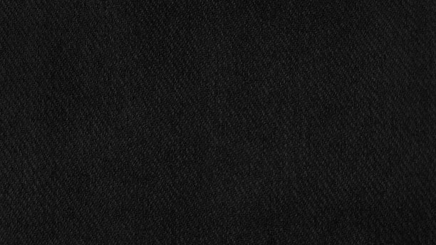 黑色面料纹理背景。贴近细节的帆布布料与空白的设计空间。深色织物纹理。衣服的背景。图片下载